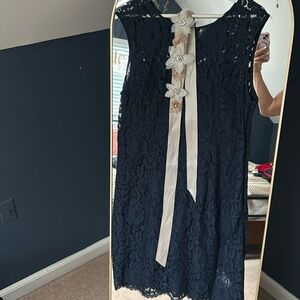 Lace dress with floral belt accessory